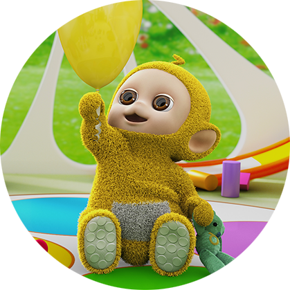 A yellow character, with a round beige face is sitting on a green floor and pointing to something.